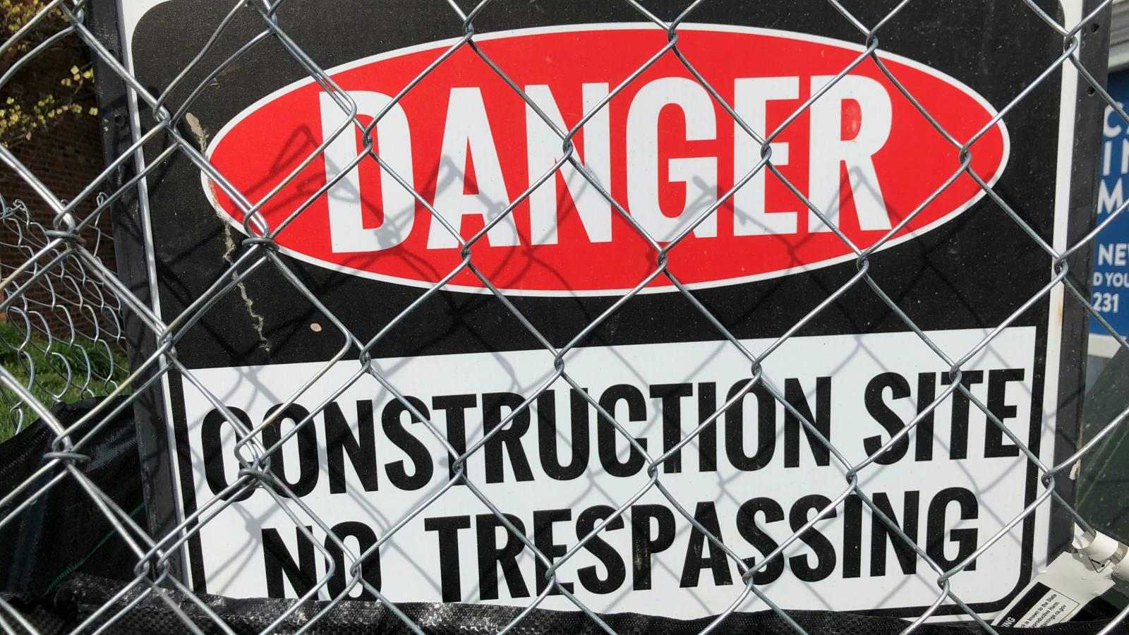 Danger signs on CONSTRUCTION SITE N0 TRESPASSING