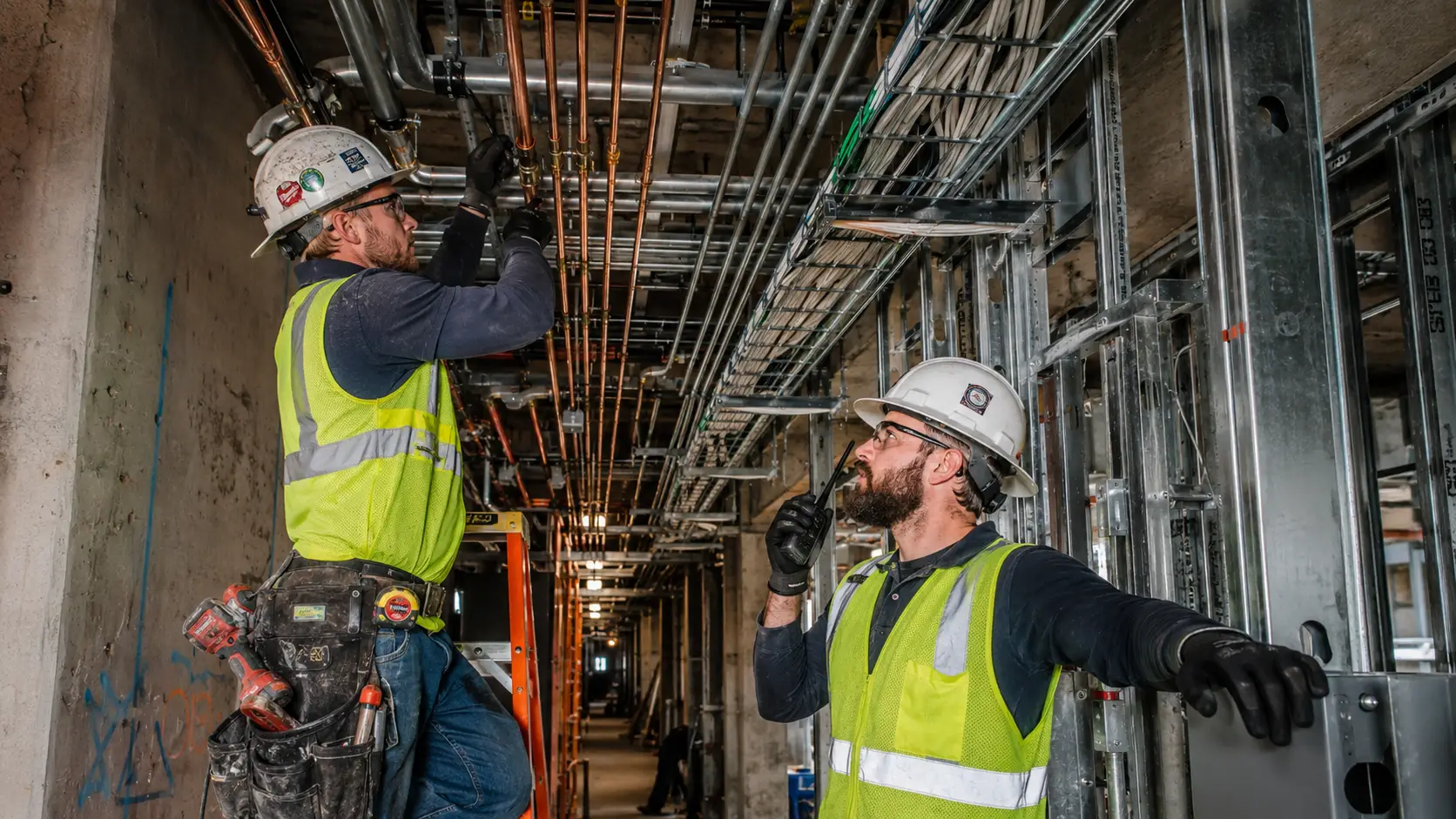 Plumbing and Electrical Coordination: Compact Radios for Tight Construction Spaces
