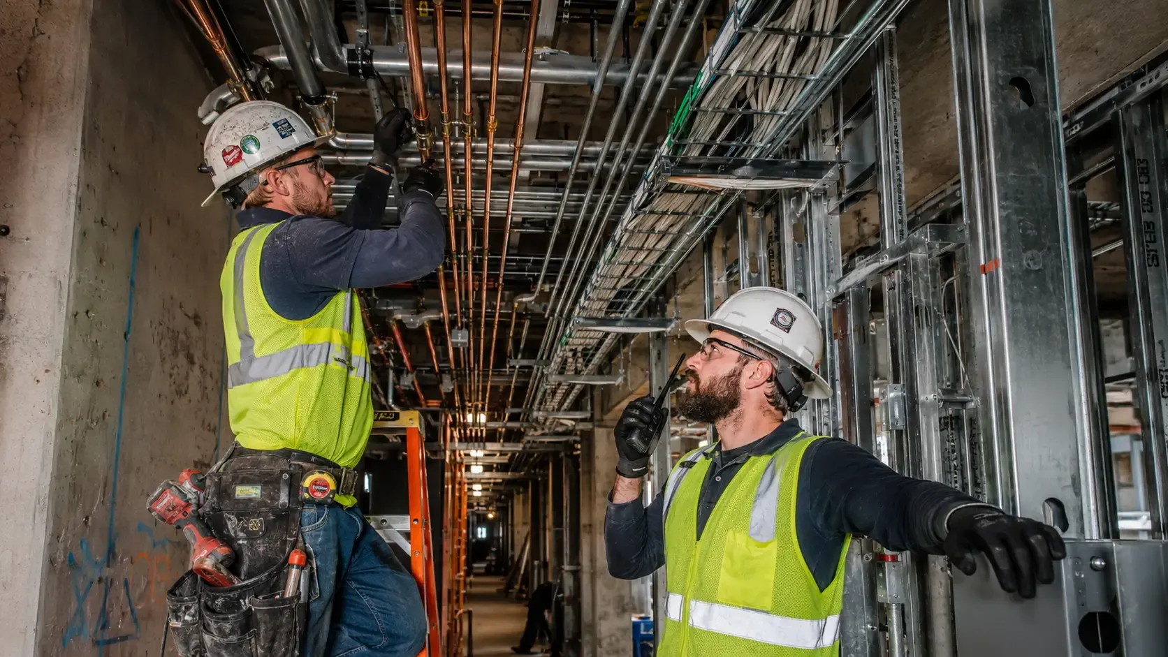 Plumbing and Electrical Coordination: Compact Radios for Tight Construction Spaces